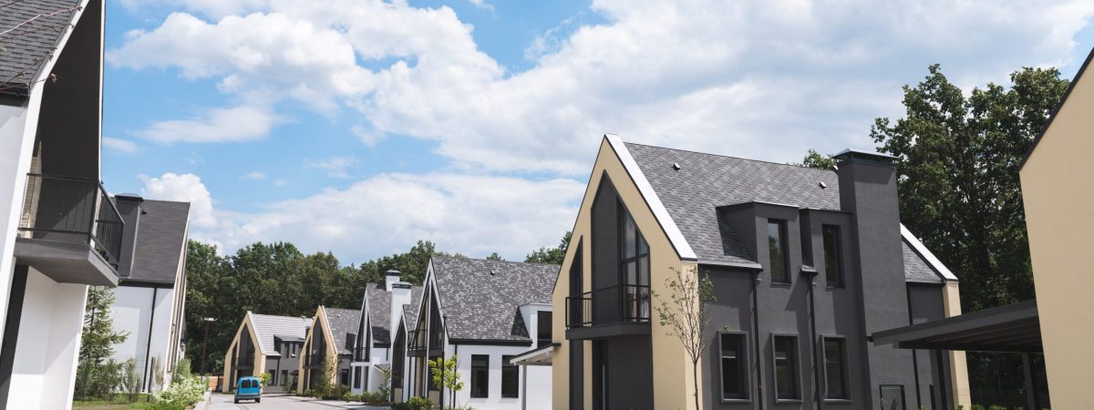 Fancy suburb. Close up of a street with beautiful new houses located on it