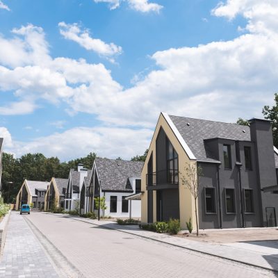 Fancy suburb. Close up of a street with beautiful new houses located on it